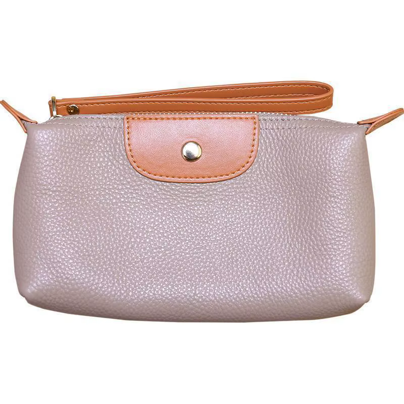 Le nouveau portefeuille pour femme en cuir souple et tendance avec des couleurs contrastées est un sac à main portable