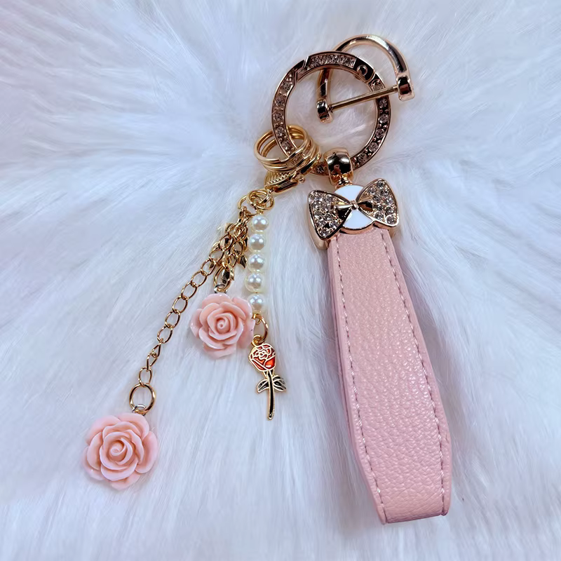 Porte-clés de luxe avec nœud et fleur