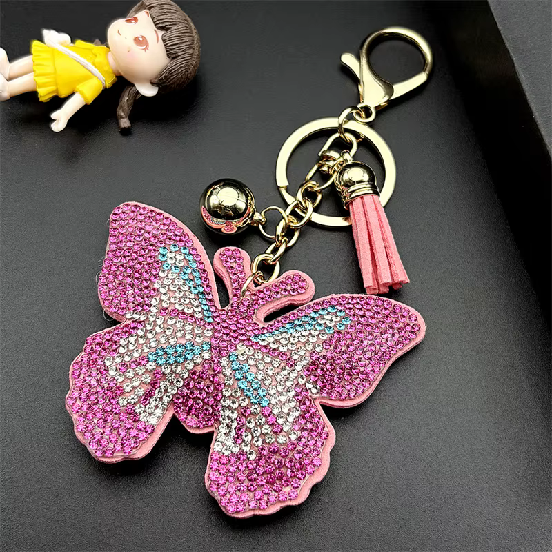 Porte-clés papillon rose pour femmes et hommes, cristal brillant, strass, pompon, sac de voiture, décoration suspendue, bijoux cadeaux