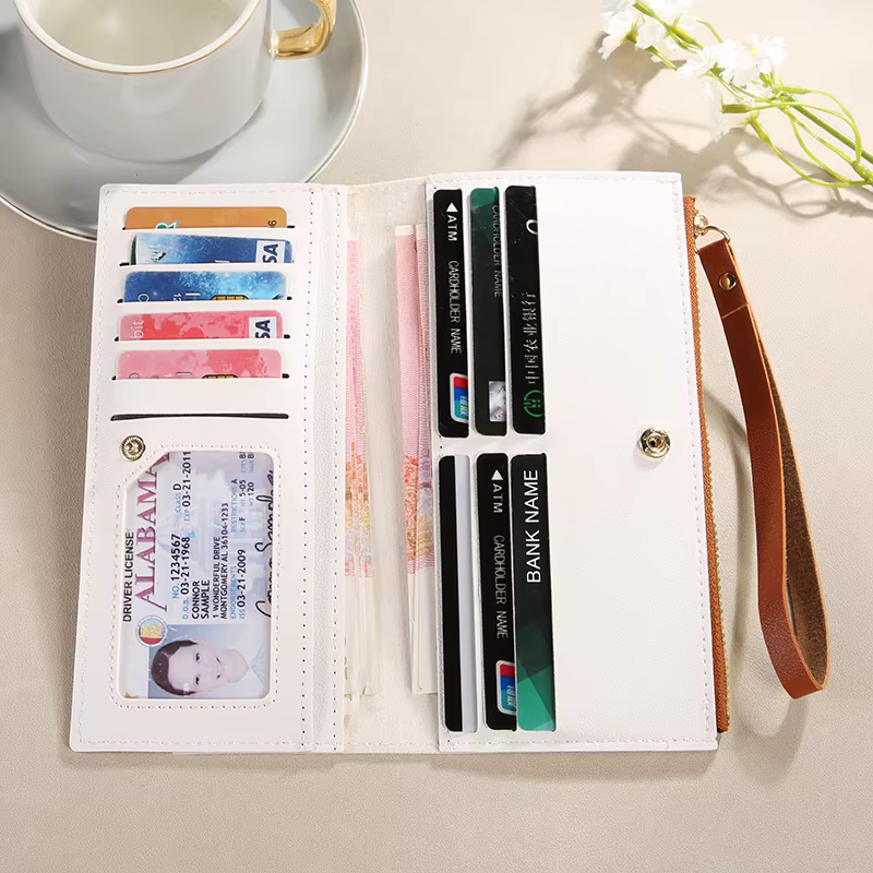 Portefeuille femme à la mode avec des couleurs contrastées ; long design à pompons ; porte-cartes multiples ; résout le