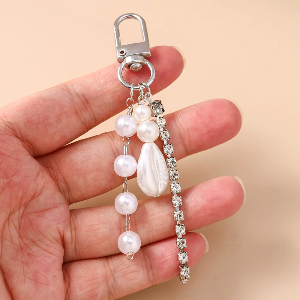 Joli porte-clés en forme de coquille de perles pour femmes et filles